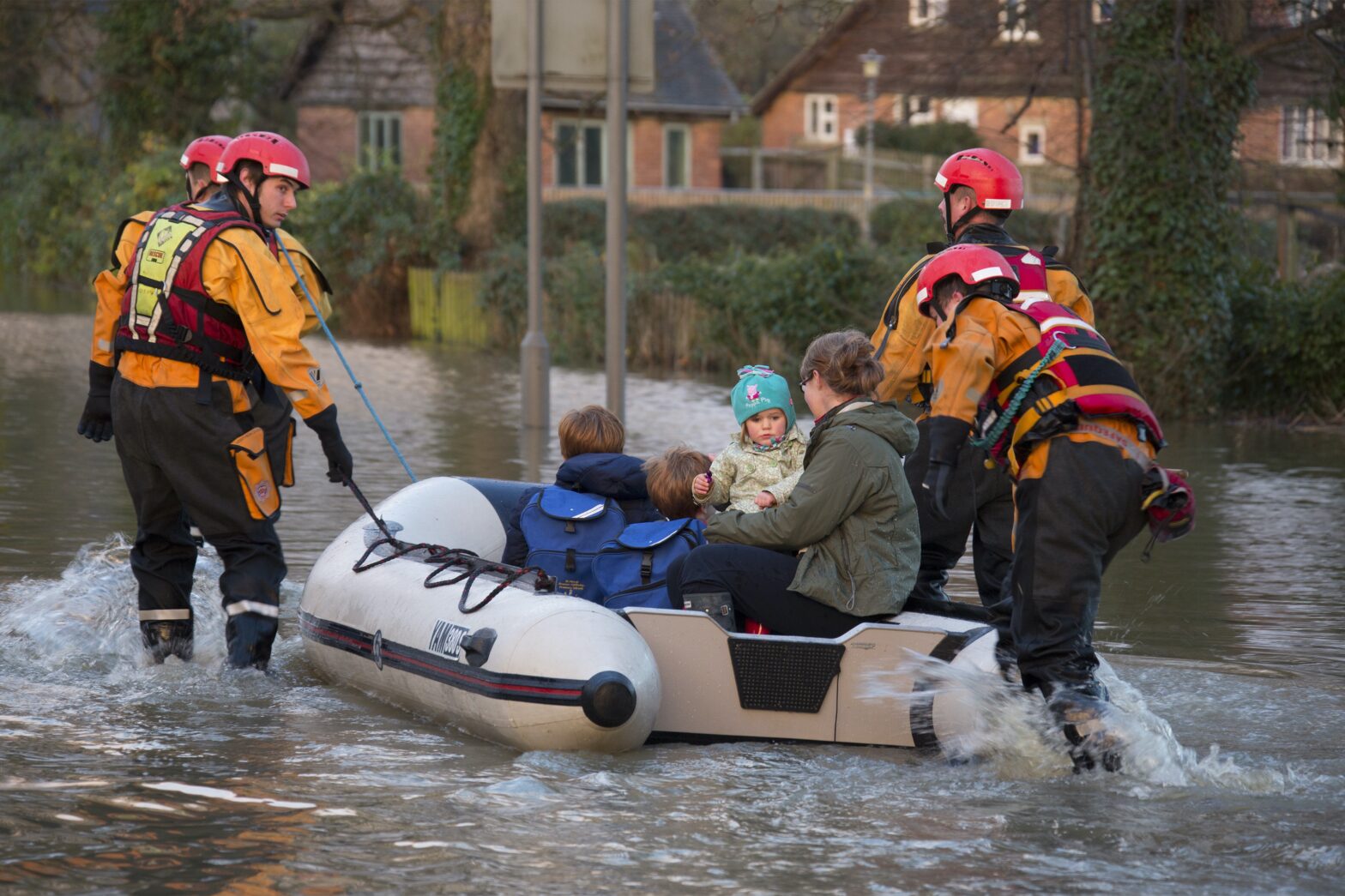 Young family being rescued by the fire service after the River Derwent burst it's banks in the village of Old Malton in North Yorkshire in northeast England.